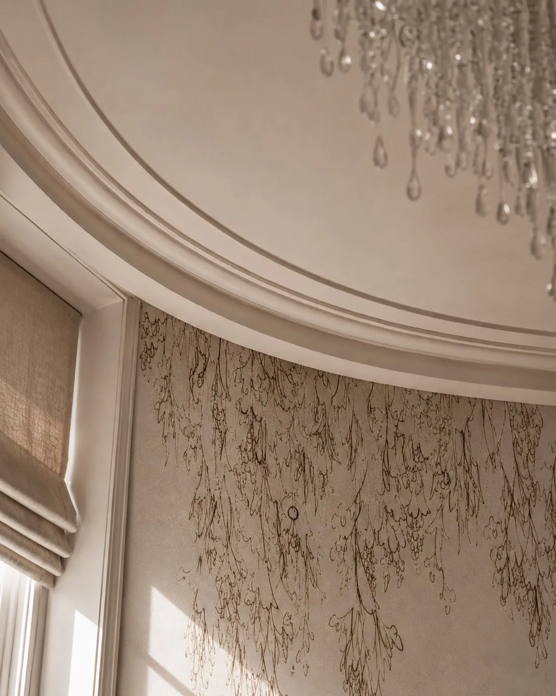 Library bay with curved cornice, cascading branch wallpaper detail and crystal chandelier