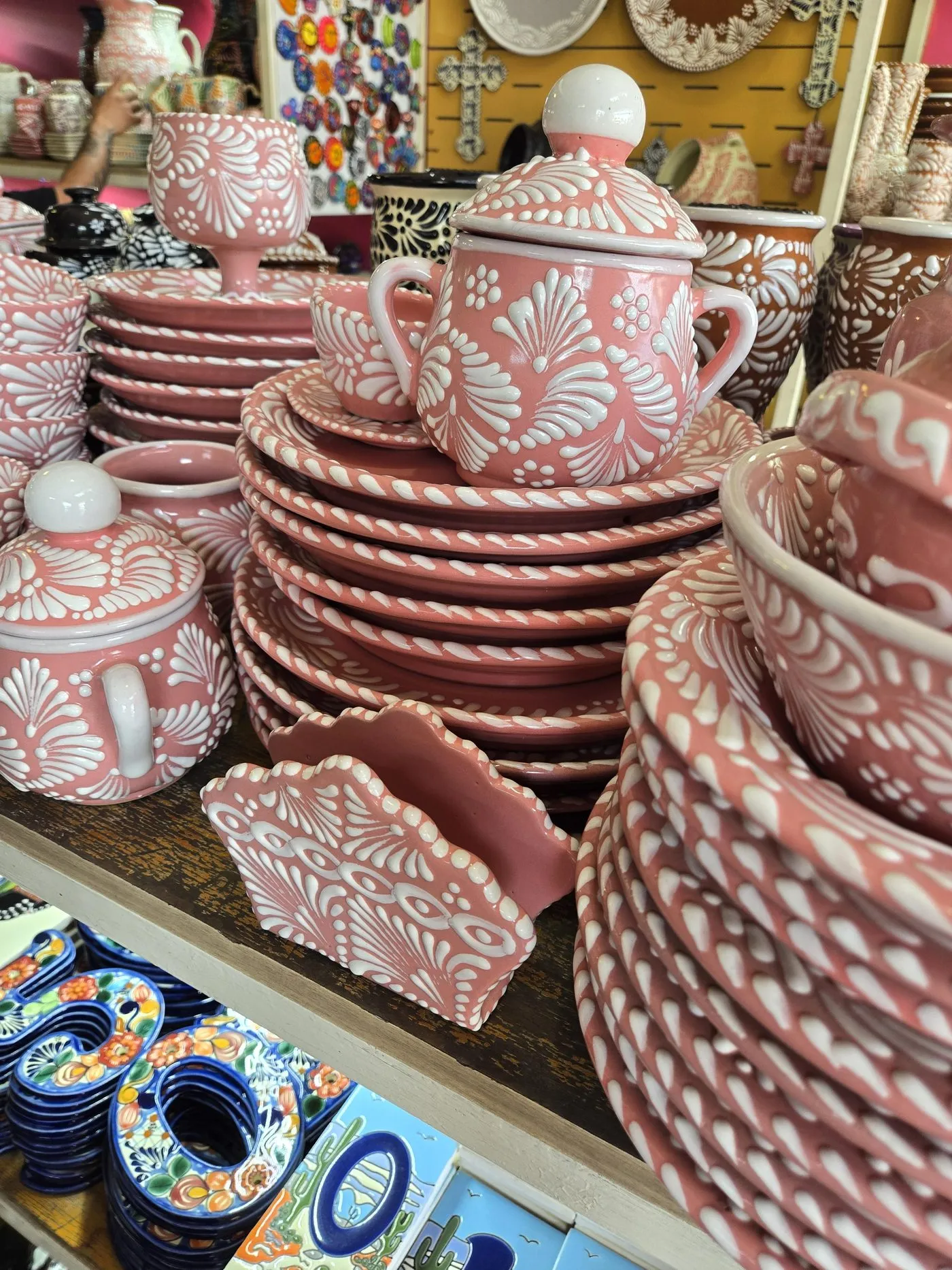 Hand-painted Mexican ceramics stacked in a workshop