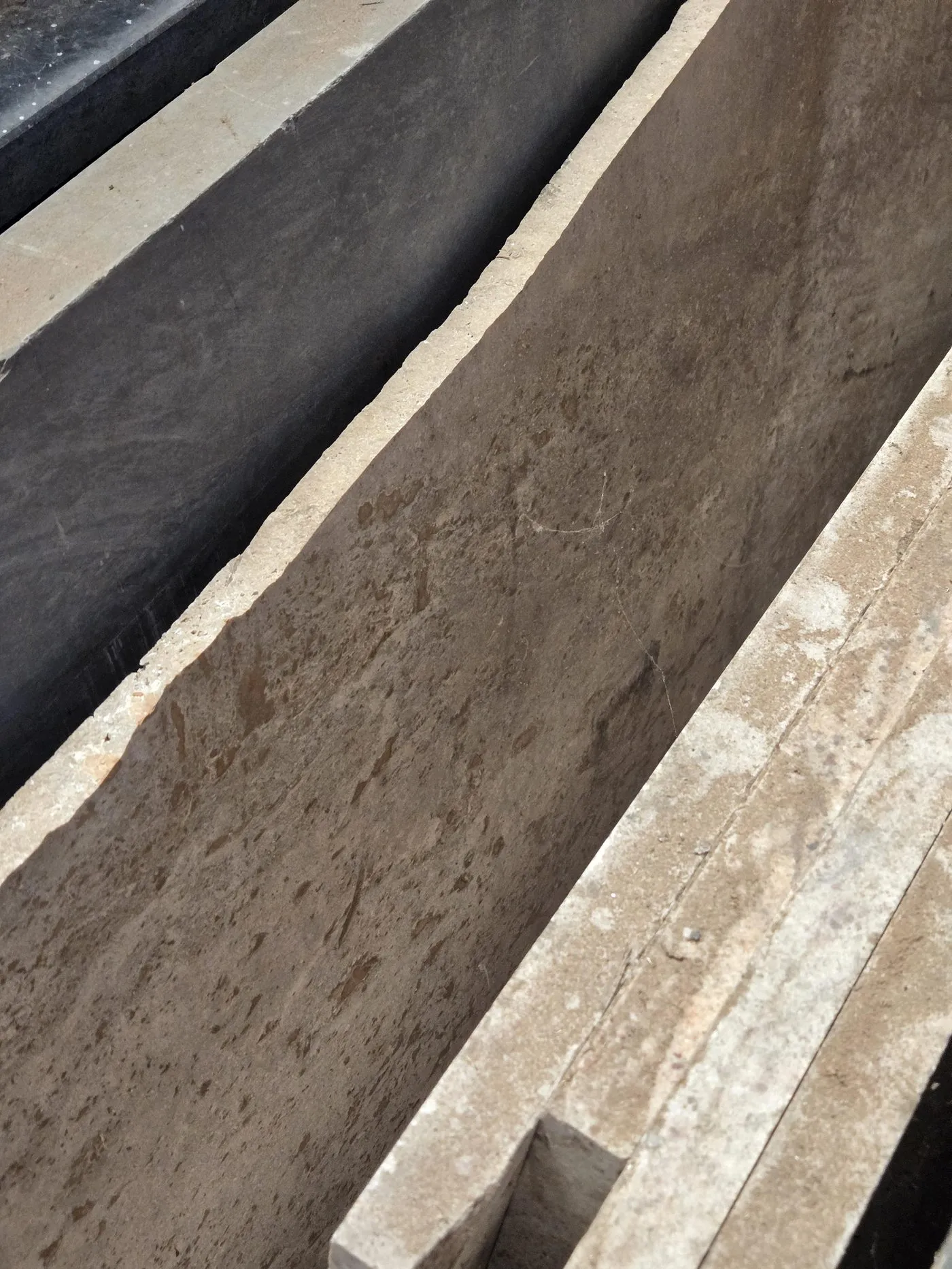Reclaimed marble and travertine slabs sourced for the tiny house build