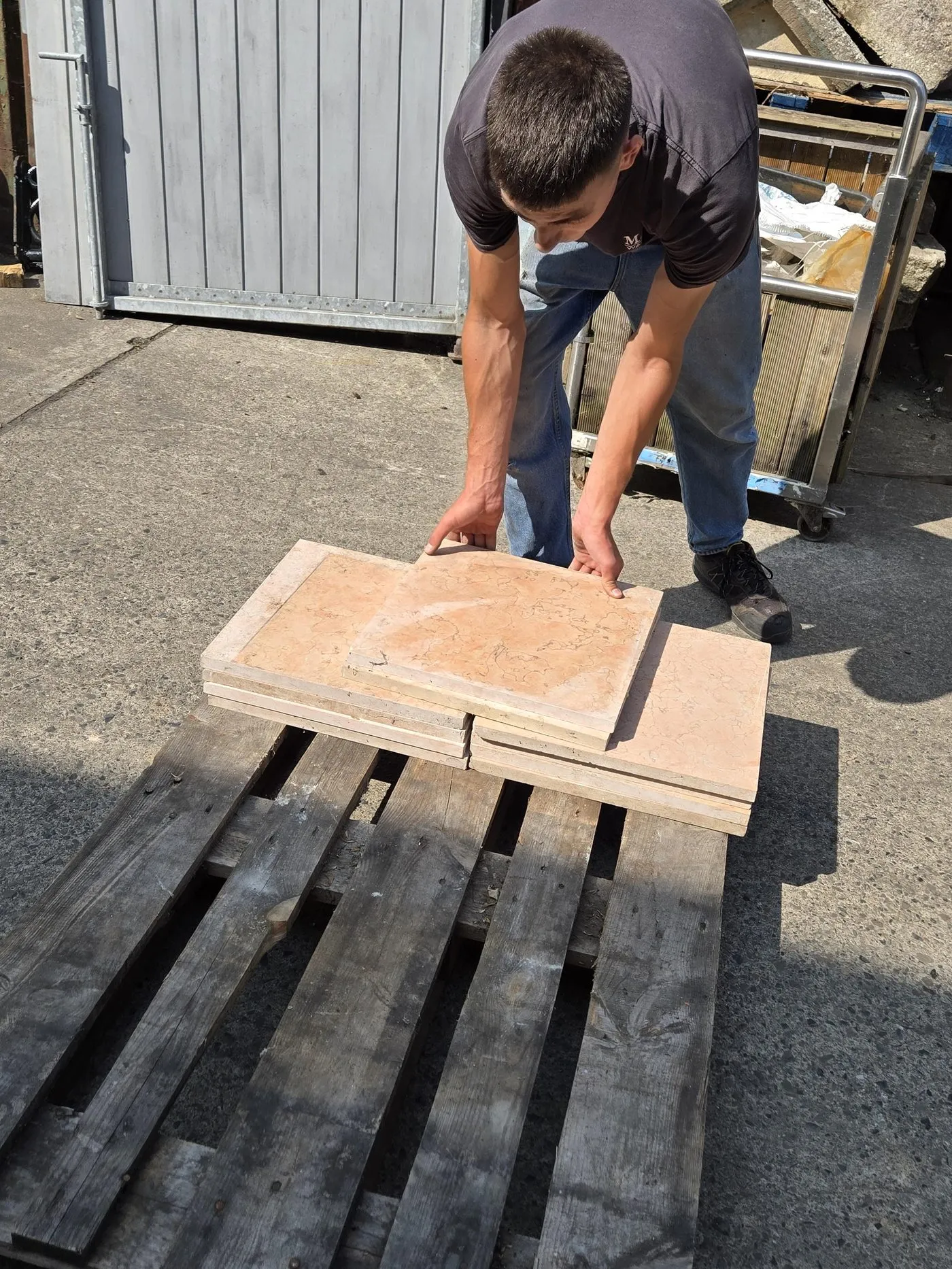 Reclaimed marble tiles being sourced for the kitchen countertop mosaic